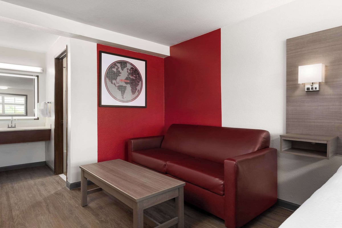 suite, 1 king bed with sofa bed, non smoking | pillow-top beds, desk, laptop workspace, blackout curtains