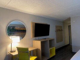 Desk, laptop workspace, blackout drapes, iron/ironing board