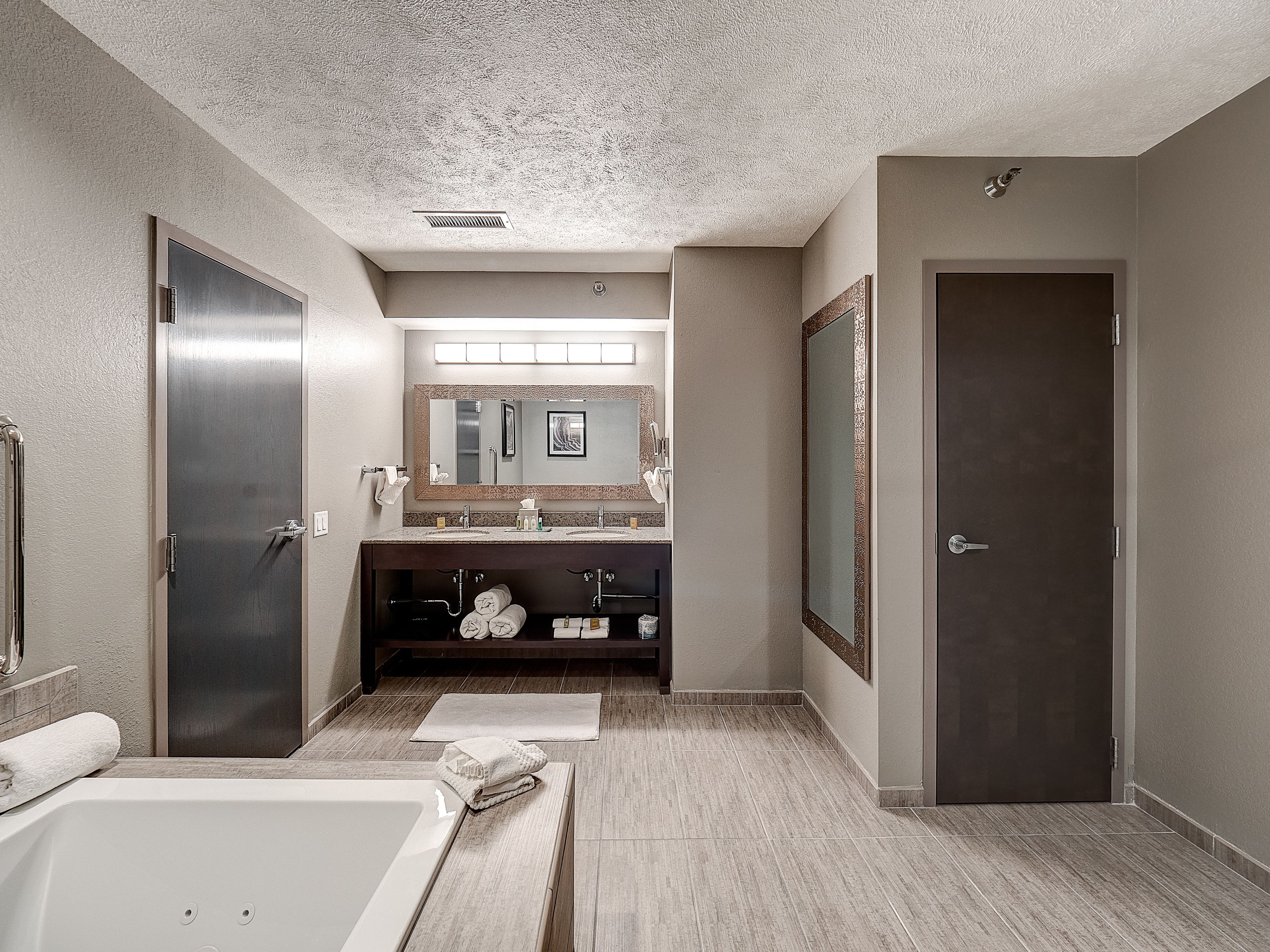 junior studio suite, 1 king bed, non smoking (presidential) | bathroom | eco-friendly toiletries, hair dryer, towels, soap