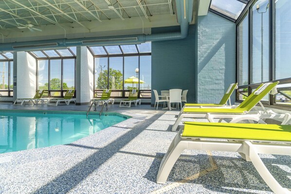 Indoor pool, open 10:00 AM to 10 PM, pool loungers