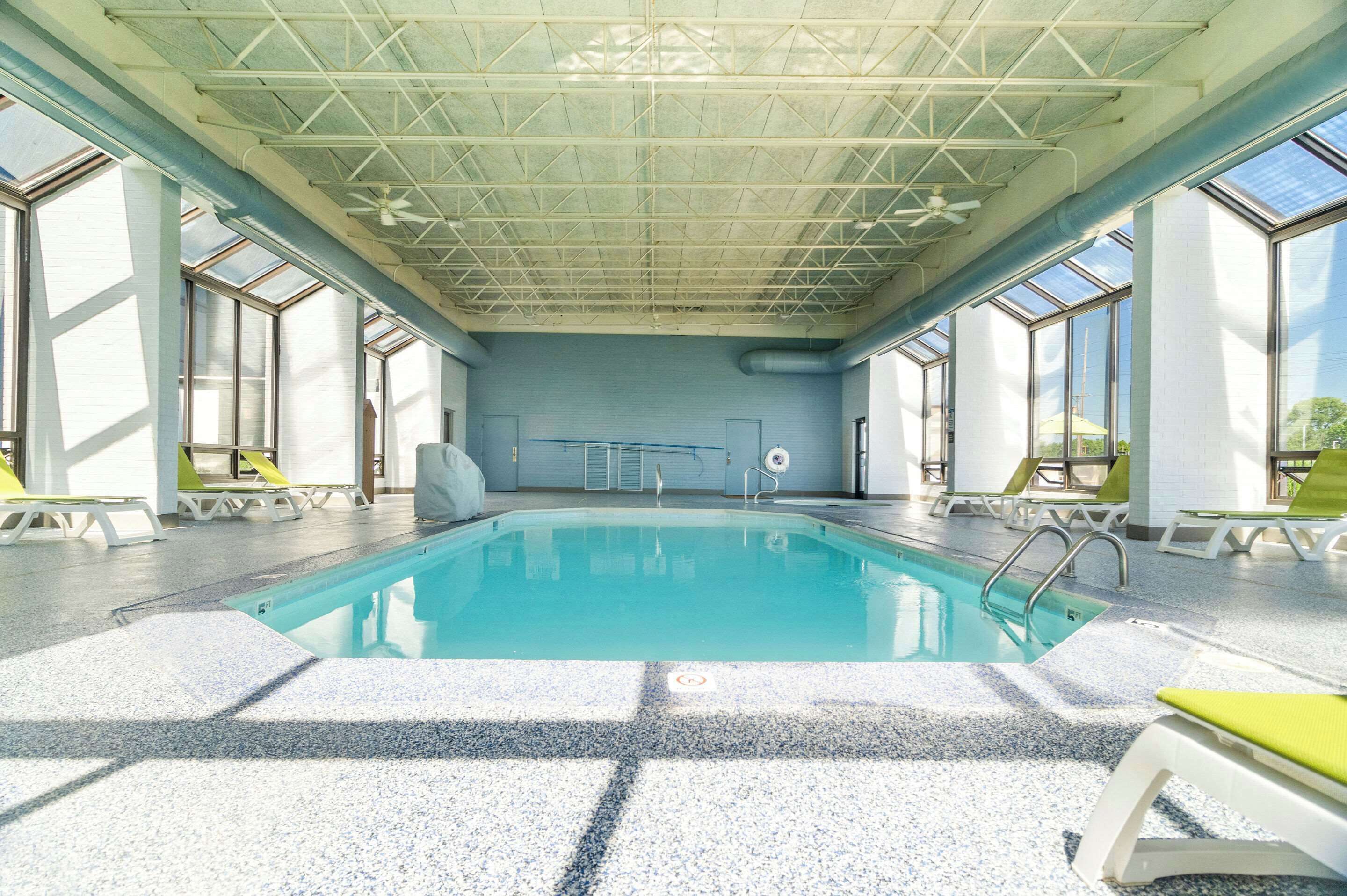 Indoor pool, open 10:00 AM to 10 PM, pool loungers