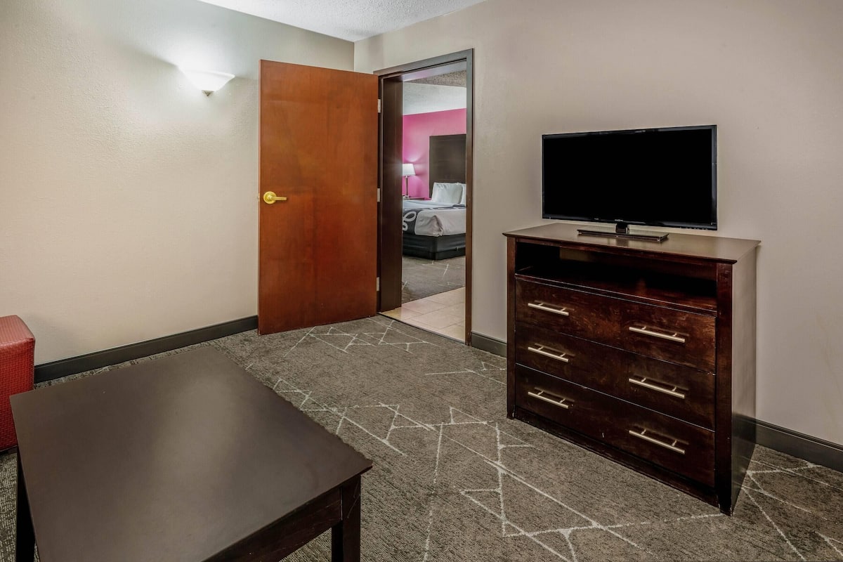 Premium bedding, desk, laptop workspace, blackout curtains