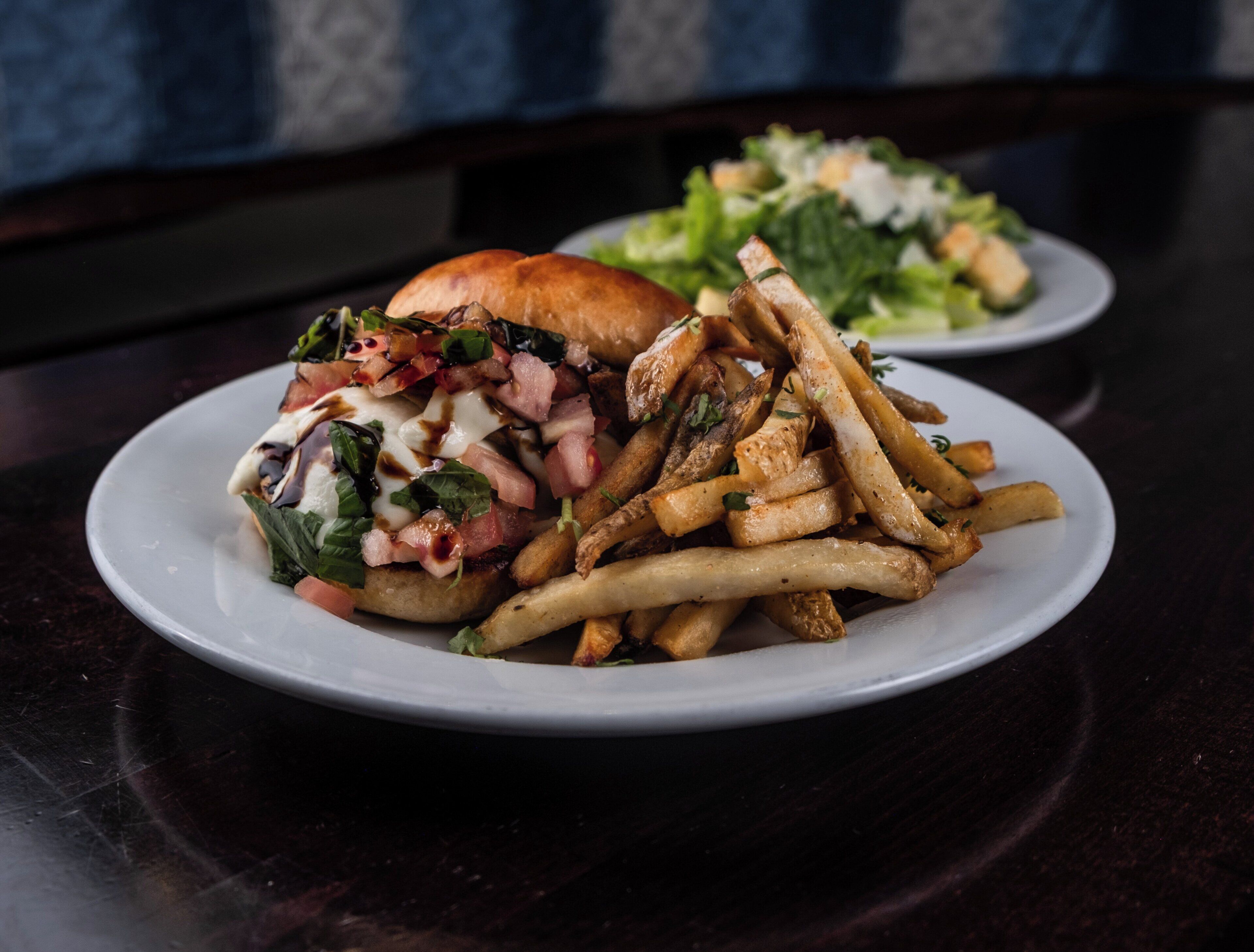 A plate of food with a burger and fries.