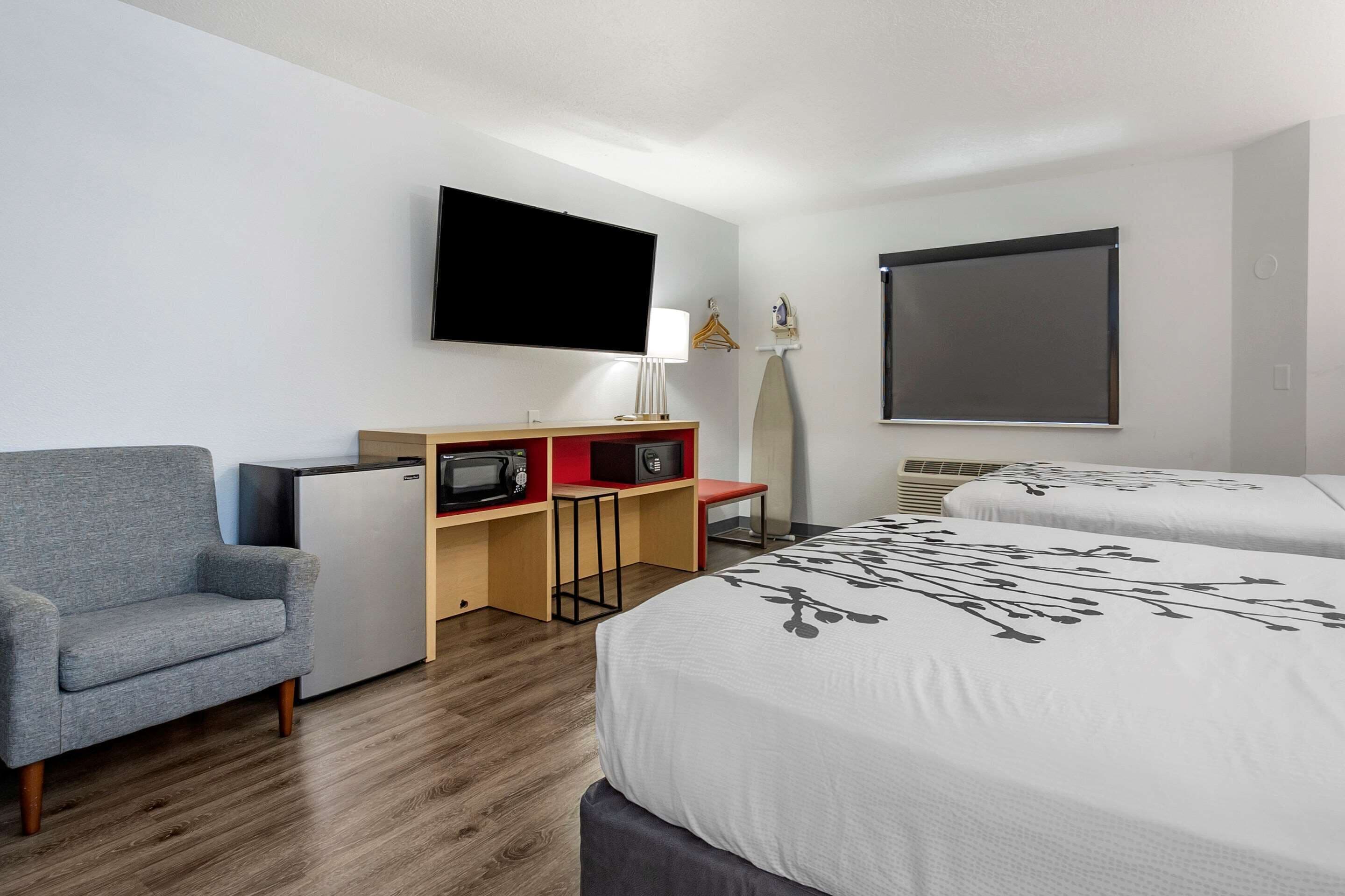 standard room, 2 double beds, non smoking | in-room safe, desk, iron/ironing board, rollaway beds