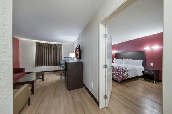 Suite, 1 King Bed, Non Smoking | Desk, iron/ironing board, WiFi (free), bed sheets
