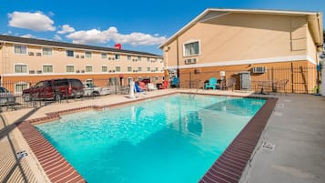 Outdoor pool, pool umbrellas, sun loungers