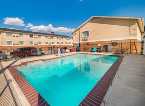 Outdoor pool, pool umbrellas, sun loungers