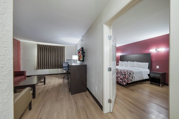 Suite, 1 King Bed, Non Smoking | Desk, iron/ironing board, WiFi (free), bed sheets