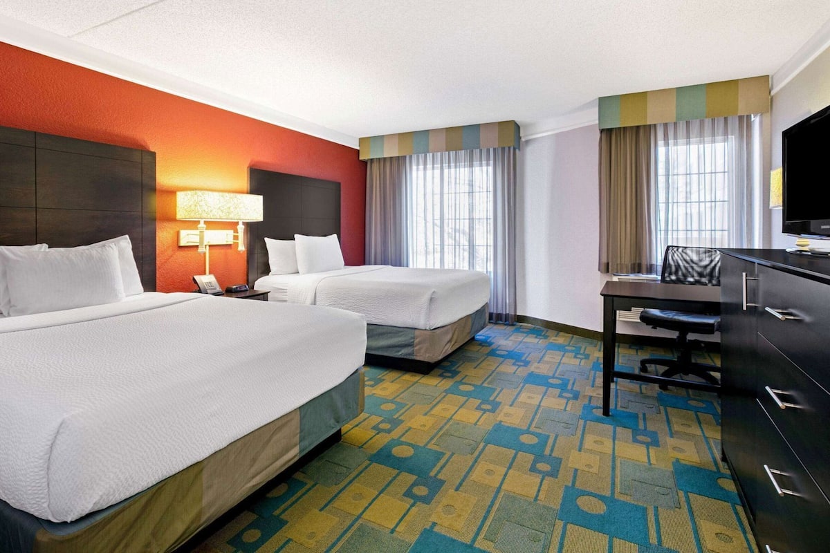 Premium bedding, desk, laptop workspace, iron/ironing board