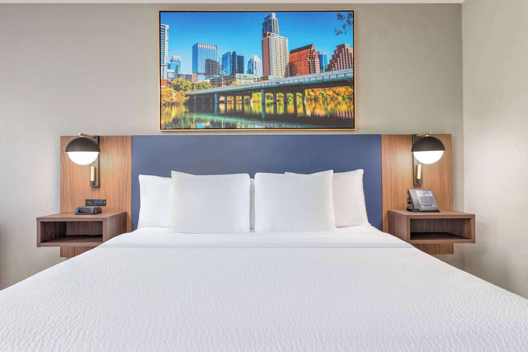 Premium bedding, desk, laptop workspace, iron/ironing board