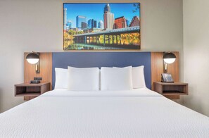 Premium bedding, desk, laptop workspace, iron/ironing board