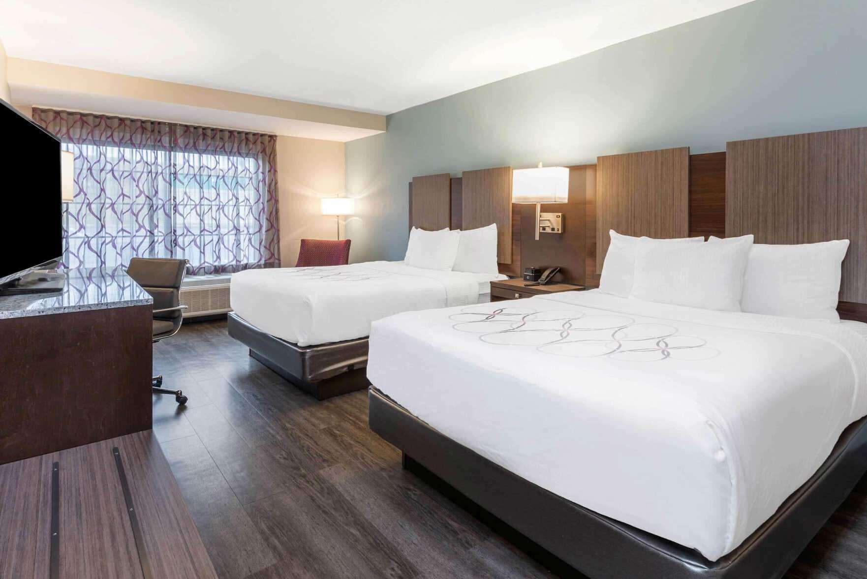 Hypo-allergenic bedding, pillow-top beds, desk, laptop workspace