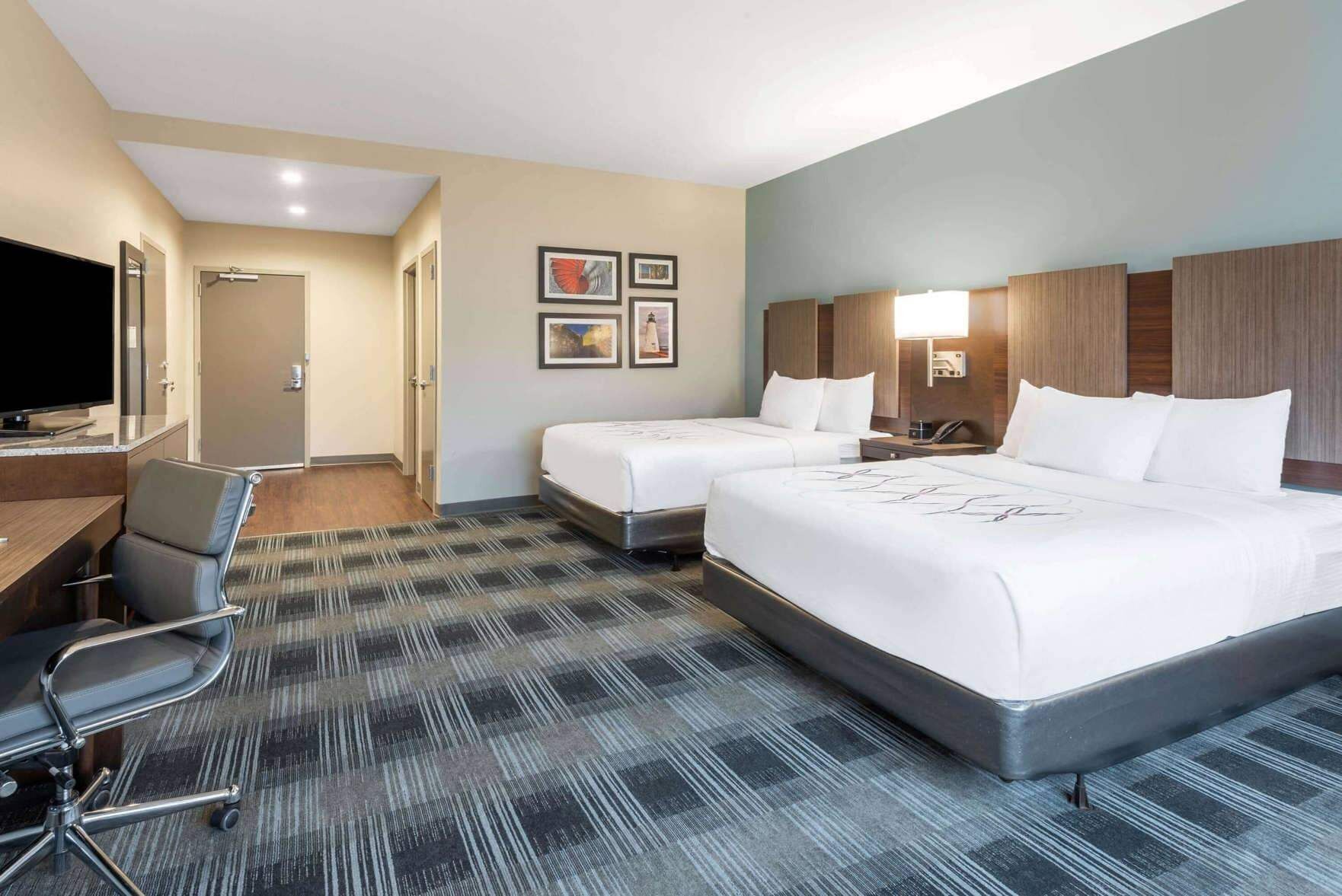 Hypo-allergenic bedding, pillow-top beds, desk, laptop workspace
