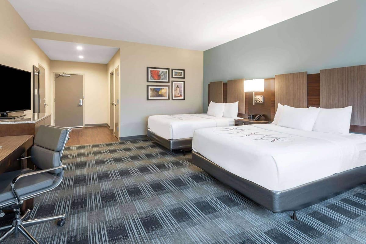 Hypo-allergenic bedding, pillow-top beds, desk, laptop workspace