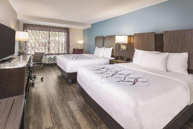 Hypo-allergenic bedding, pillow-top beds, desk, laptop workspace