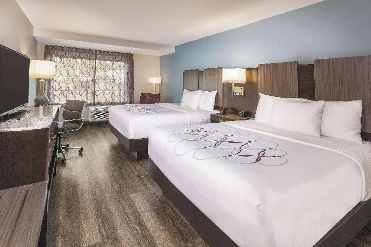 Hypo-allergenic bedding, pillow-top beds, desk, laptop workspace