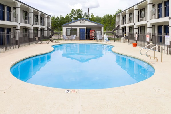 Outdoor pool, open 9:00 AM to 9:00 PM, pool loungers