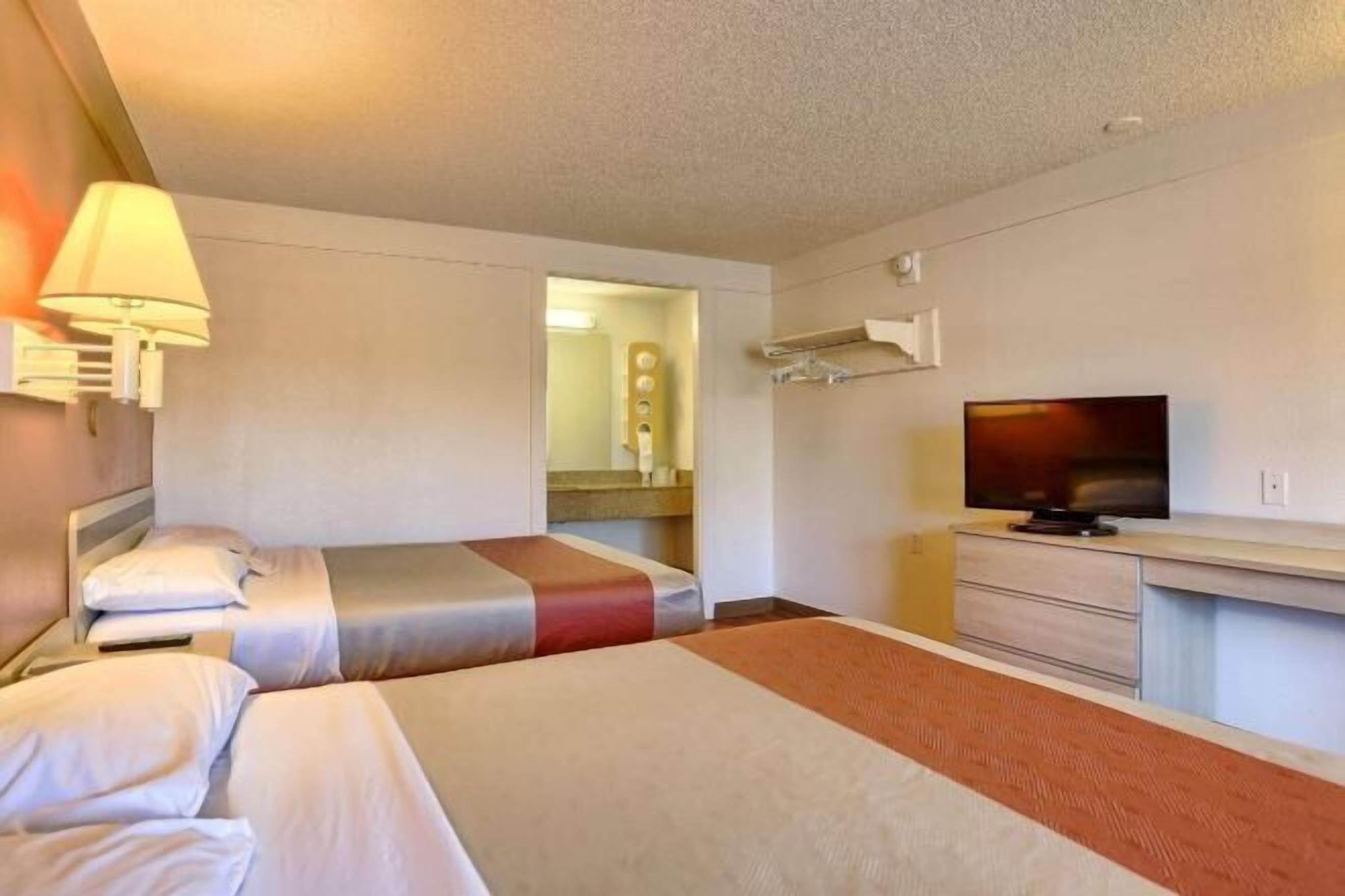 Desk, laptop workspace, blackout curtains, free WiFi