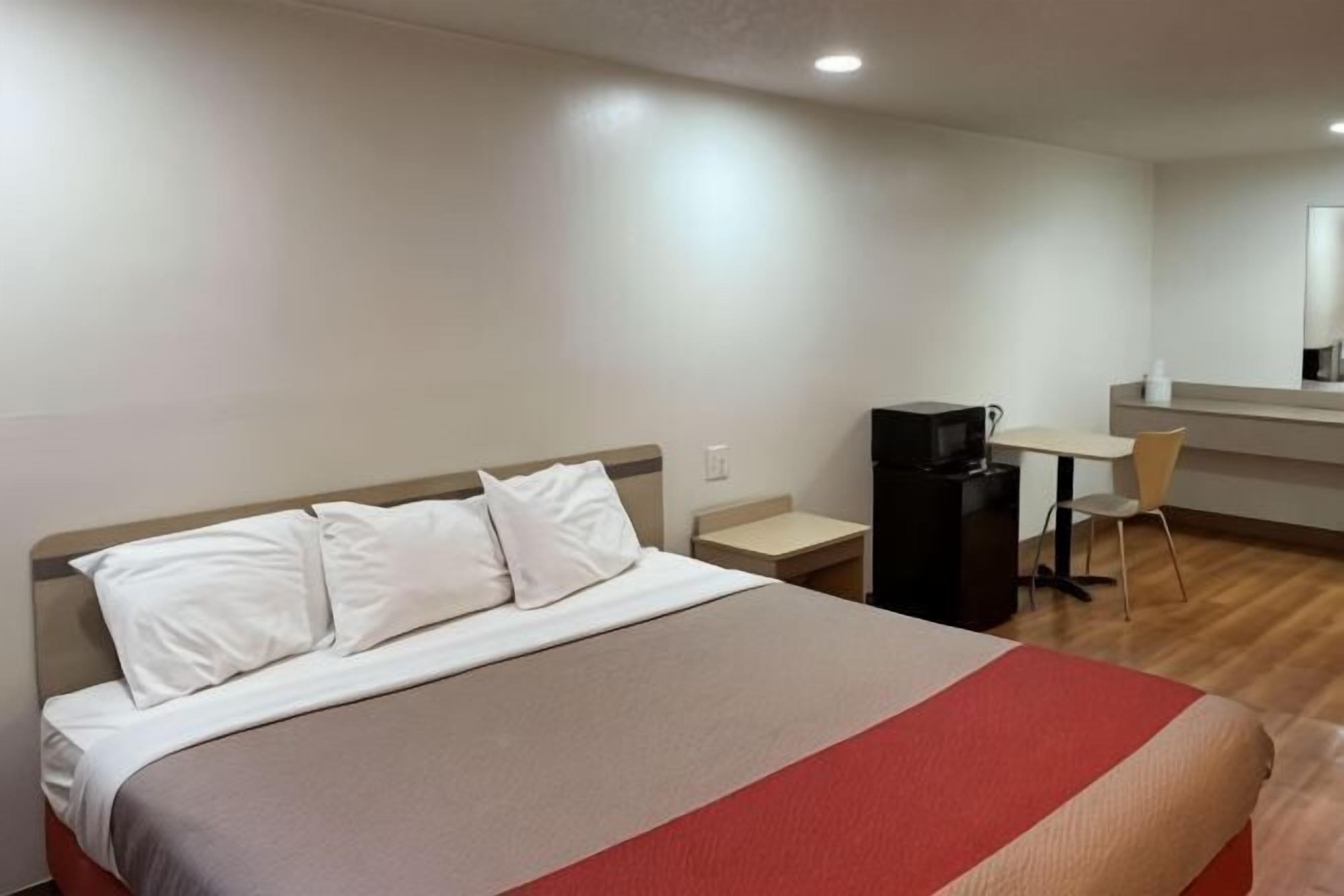 Desk, laptop workspace, blackout curtains, free WiFi