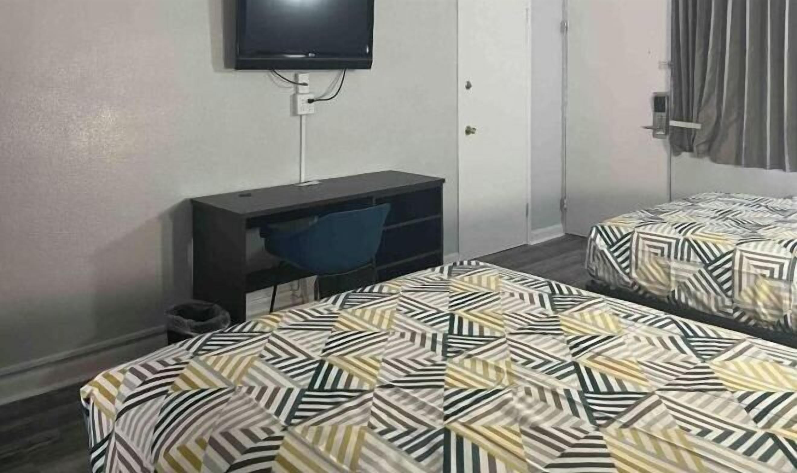 Desk, laptop workspace, blackout curtains, free WiFi