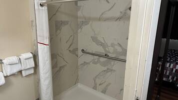 Deluxe Room, 1 Queen Bed, Accessible, Non Smoking (Roll-In Shower) | Bathroom | Combined shower/tub, free toiletries, towels, soap