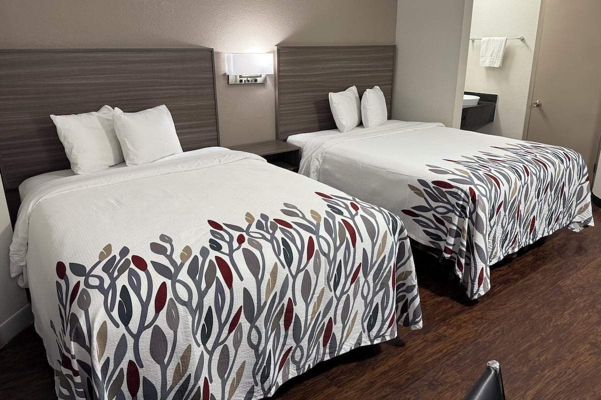 Deluxe Room, 2 Queen Beds, Non Smoking | Desk, laptop workspace, blackout drapes, free cribs/infant beds