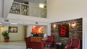 A Red Roof Inn lobby with a seating area, a kitchenette, and a view of the upper floor. - Red Roof Inn San Antonio - Airport (San Antonio)