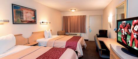 A hotel room with two beds, a desk, a television, and a painting on the wall.