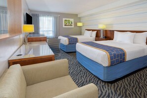A hotel room with two beds, a desk, a chair, and a television. - Days Inn by Wyndham Manassas Battlefield (Manassas)