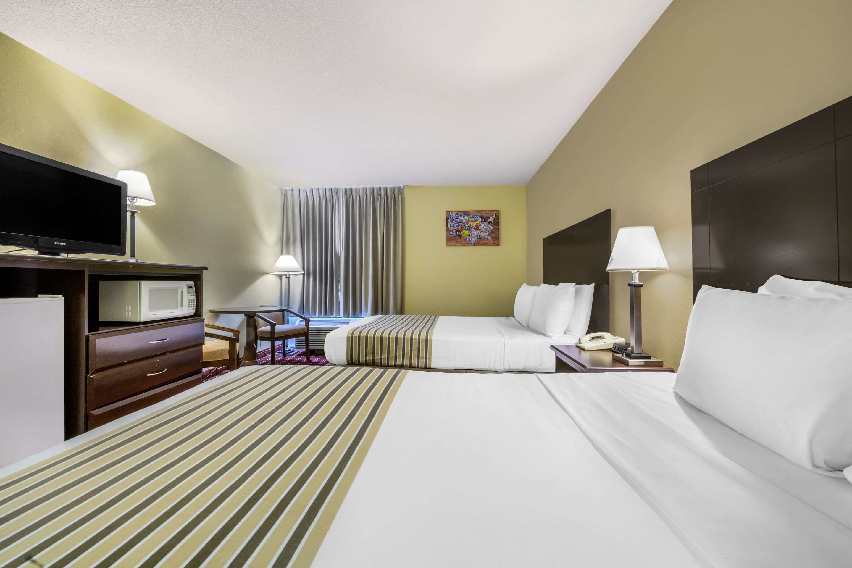 Standard Room, 2 Queen Beds, Non Smoking | Iron/ironing board, free cribs/infant beds, free WiFi, bed sheets