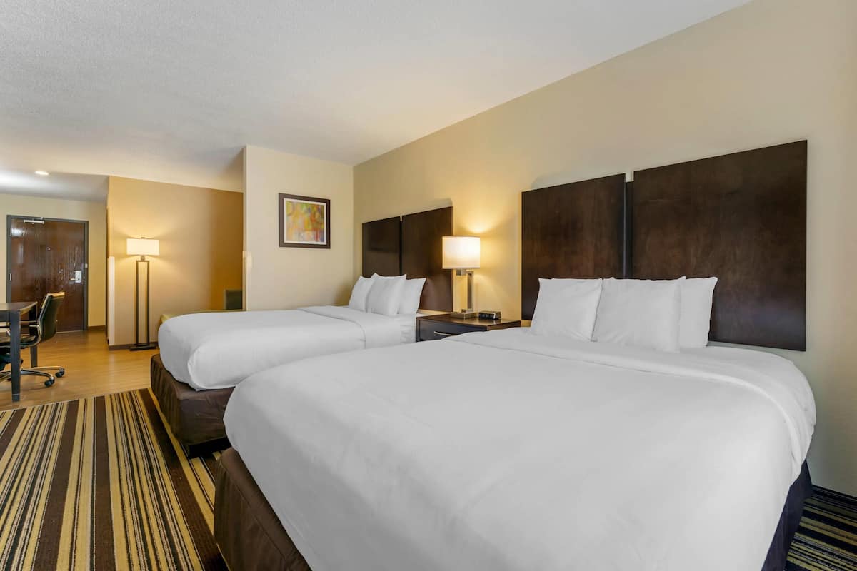 Suite, 2 Queen Beds, Non Smoking | Iron/ironing board, cribs (free), WiFi (free), bed sheets