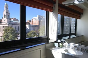 Premier Room, 1 King Bed | Bathroom | Combined shower/tub, rainfall showerhead, eco-friendly toiletries