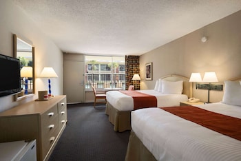 In-room safe, desk, soundproofing, iron/ironing board at Ramada by Wyndham Kissimmee Gateway