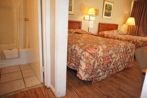 Standard Room, 2 Double Beds | Bathroom | Shower, hair dryer, towels