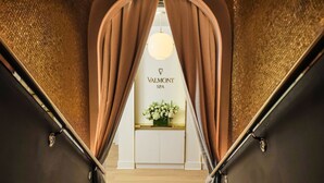 A staircase leading to a spa area with a sign reading "VALMONT SPA". - The Carlyle, A Rosewood Hotel (New York)