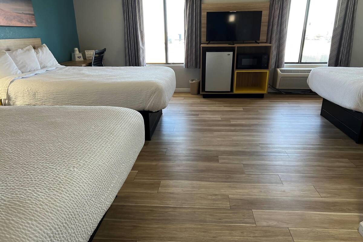 Basic Suite, Multiple Beds, Non Smoking | Desk, laptop workspace, WiFi (free), alarm clocks