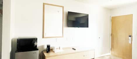 Desk, laptop workspace, blackout drapes, iron/ironing board