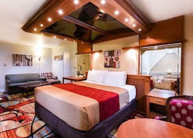 Suite, 1 King Bed | In-room safe, desk, blackout drapes, iron/ironing board (on request)