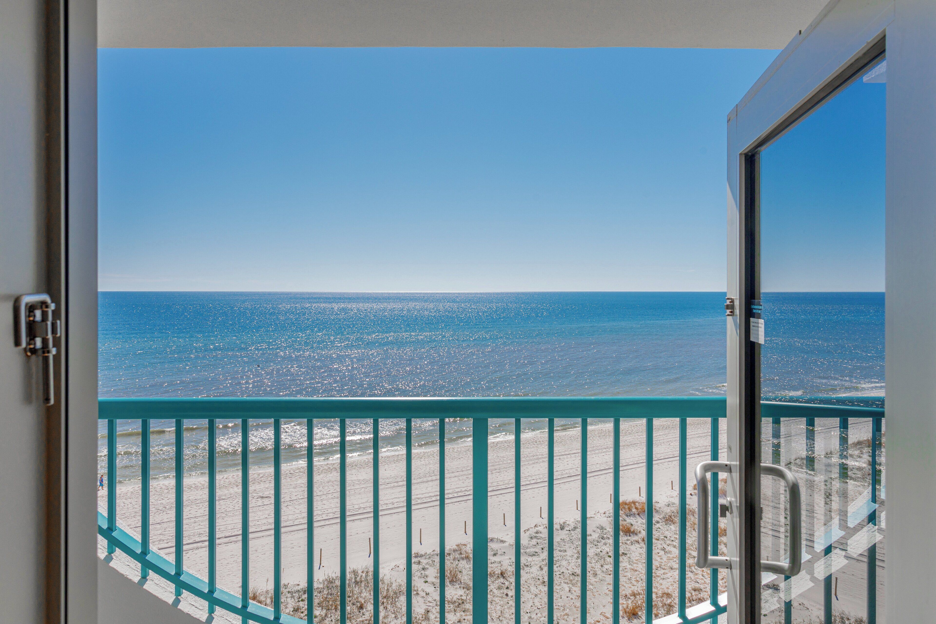 A balcony with a view of the ocean.