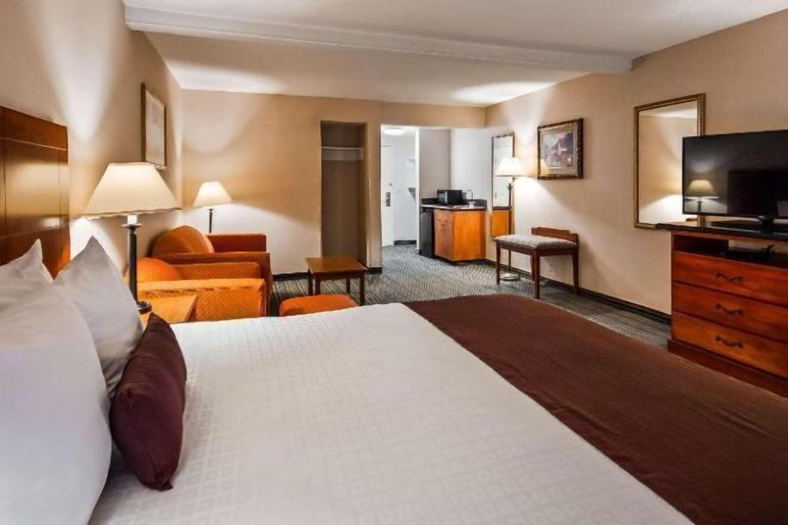 Laptop workspace, blackout drapes, iron/ironing board