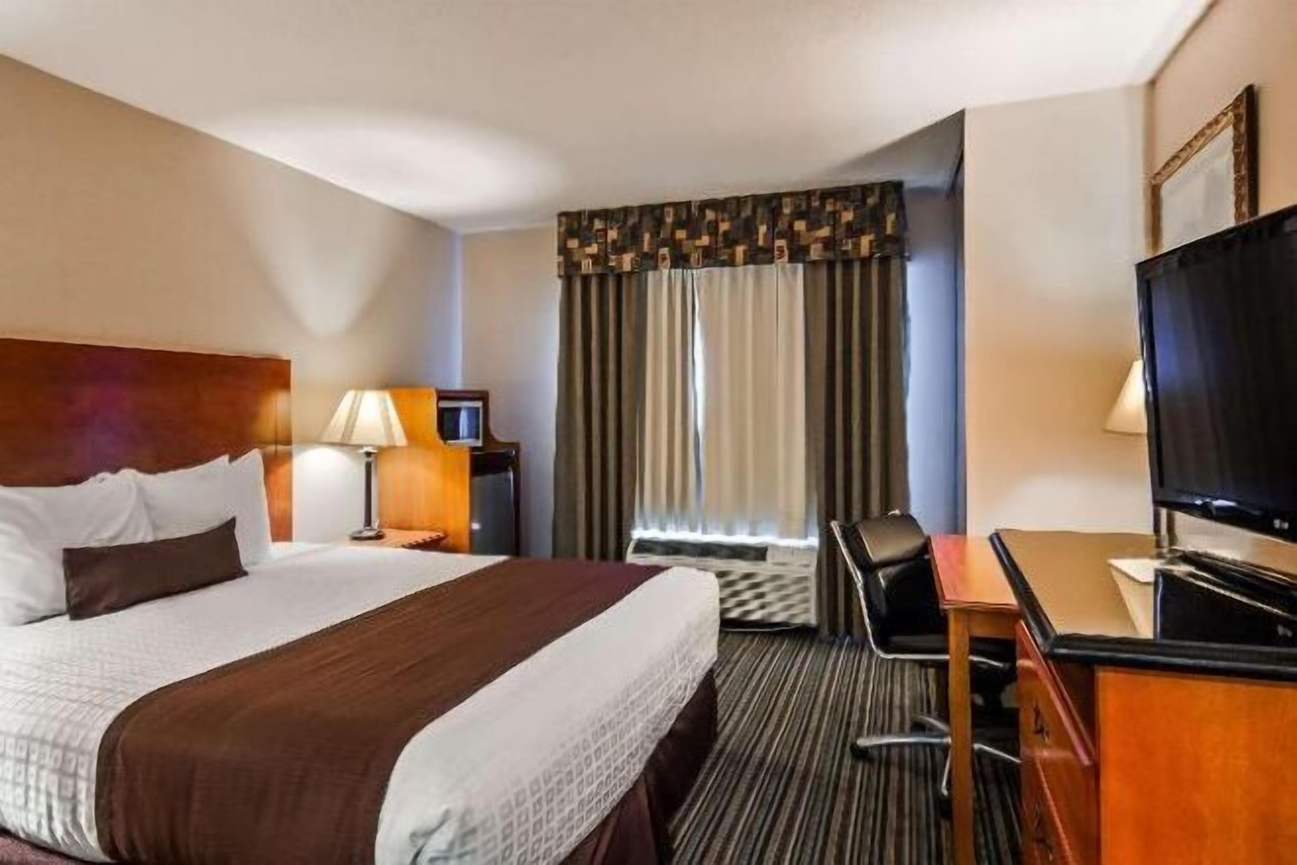 Laptop workspace, blackout drapes, iron/ironing board