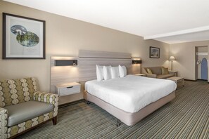 Suite, 1 King Bed, Accessible, Refrigerator & Microwave (with Single Sofabed) | Laptop workspace, blackout drapes, iron/ironing board