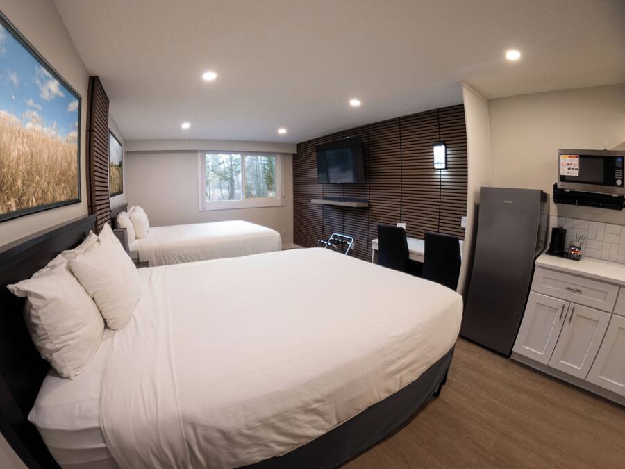 Deluxe Room, 2 Queen Beds, Non Smoking, City View | In-room safe, desk, laptop workspace, blackout drapes