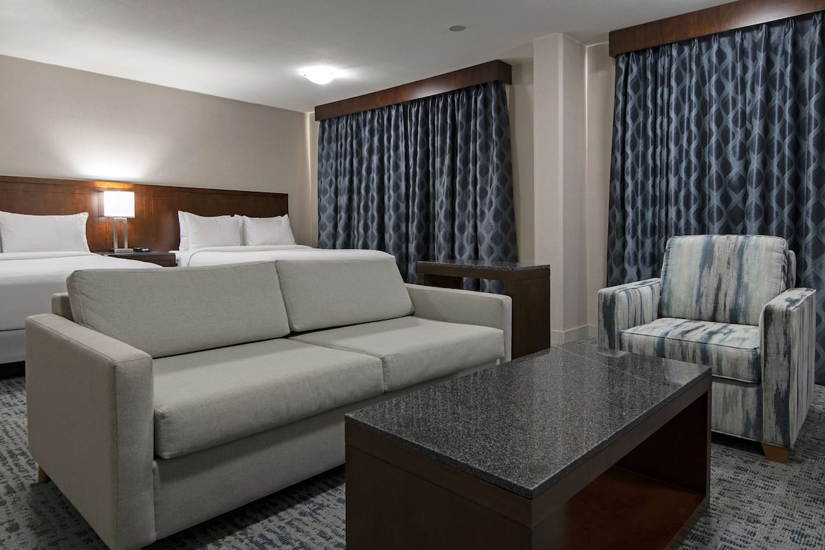 Junior Suite, 2 Queen Beds | Living area | 55-inch LCD TV with cable channels, TV, pay movies