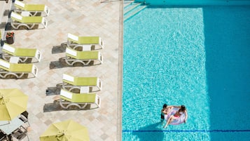 Seasonal outdoor pool, pool loungers