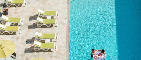 Seasonal outdoor pool, pool loungers