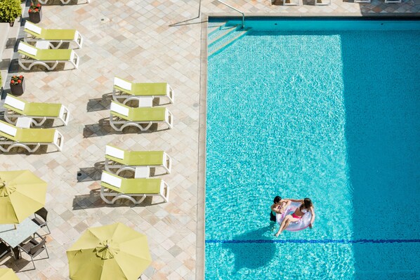 Seasonal outdoor pool, pool loungers