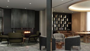 Una sala de estar moderna con chimenea, zona de estar y estantería.