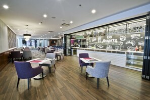 Breakfast, lunch, dinner served; local and international cuisine  - Hilton Montreal Laval (Laval)