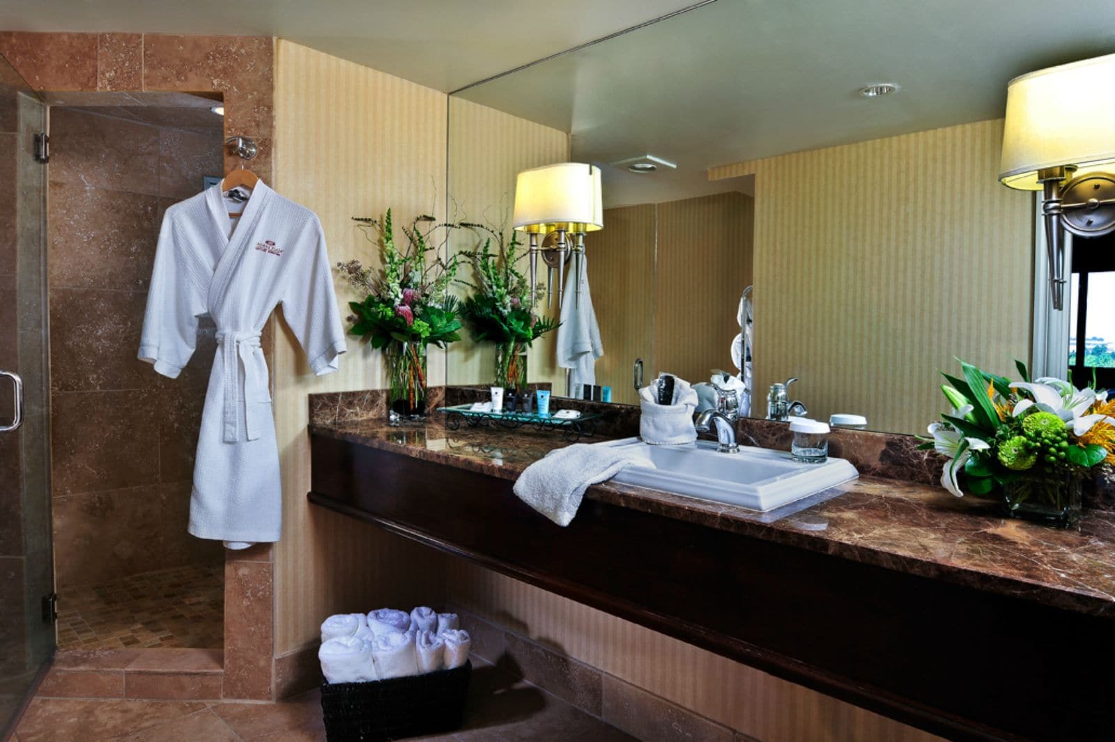 combined shower/bathtub, designer toiletries, hair dryer, towels